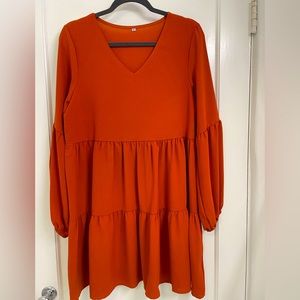 Size medium burnt orange long sleeve dress!